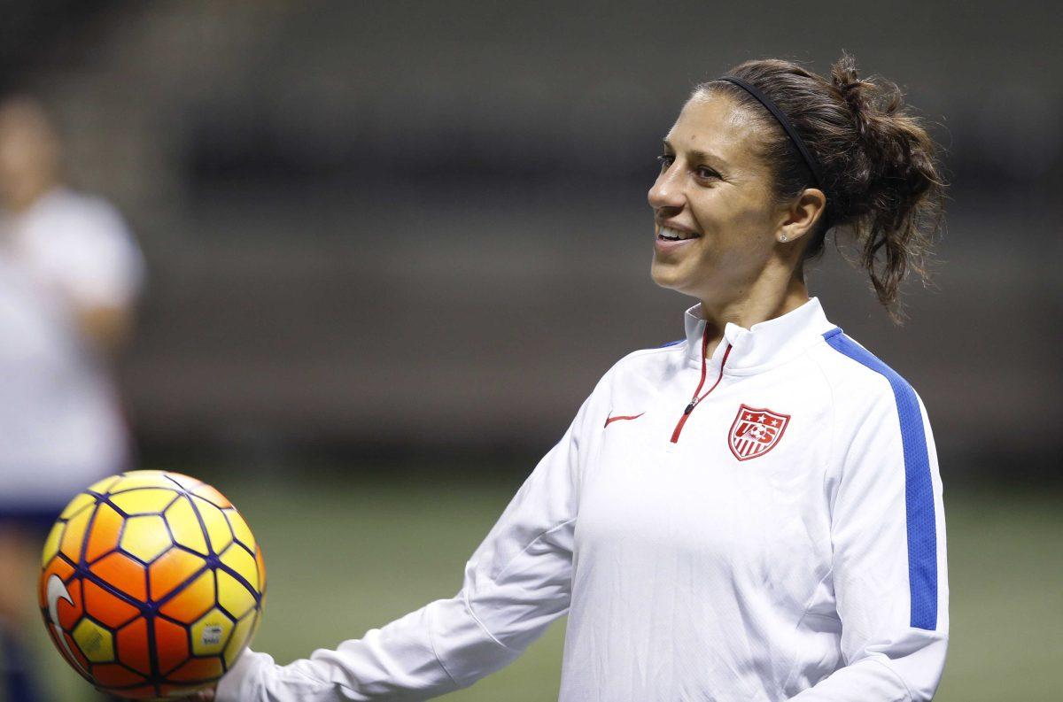 FILE - In this Dec. 15, 2015, file photo, U.S. midfielder Carli Lloyd smiles during a practice session for the team's international soccer friendly against China in New Orleans. Lloyd and defender Becky Sauerbrunn have been chosen captains of the U.S. Women's National Team. (AP Photo/Gerald Herbert, File)