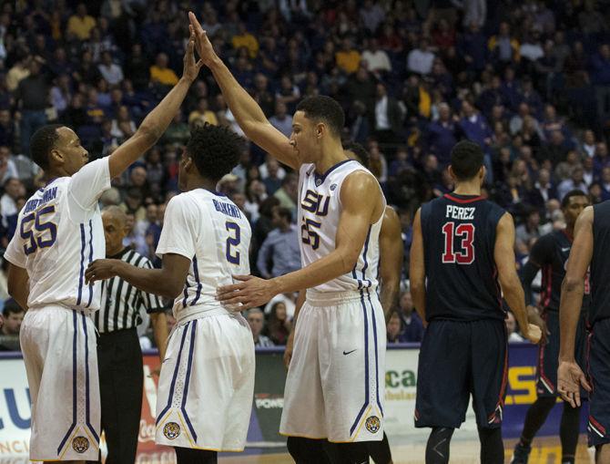 LSU freshman forward Ben Simmons (25), junior guard Tim Quarterman (55) and freshman guard Antonio Blakeney (2) celebrate during the Tigers' 90-81 victory against Ole Miss on Wednesday, Jan. 13, 2016 in the PMAC.