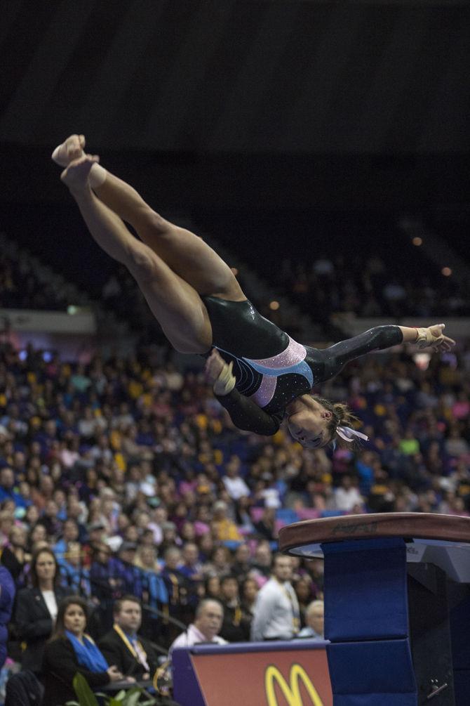 LSU all-around junior Ashleigh Gnat flips at the vault event during the Tigers' 196.575-195.100 victory against Kentucky for the Pink &amp; Blue Meet on Friday, Jan. 22, 2016 in the PMAC.