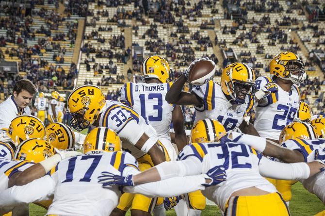 LSU junior cornerback Tre&#8217;Devious White (18), junior defensive back Dwayne Thomas (13), sophomore safety Jamal Adams (33) and senior safety Jalen Mills (28) lead the defensive huddle previous the Tigers' 31-14 defeat against The University of Arkansas on Saturday, Nov. 14, 2015 in Tiger Stadium.