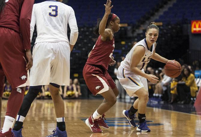 LSU junior guard Rina Hill (13) moves past her opponent Thursday, Jan. 21, 2016, during the Lady Tigers' 48-44 loss against Arkansas in the PMAC.