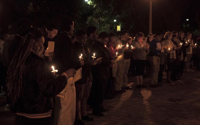 Students at a candlelight vigil and celebration honoring Martin Luther King Jr. on Monday, Jan. 18, 2016 in front of the Memorial Tower.