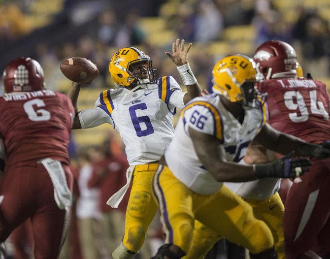 LSU sophomore quarterback Brandon Harris (6) throws an interception towards the end of the 4th quarter during the Tigers' 31-14 defeat against The University of Arkansas on Saturday, Nov. 14, 2015 in Tiger Stadium.