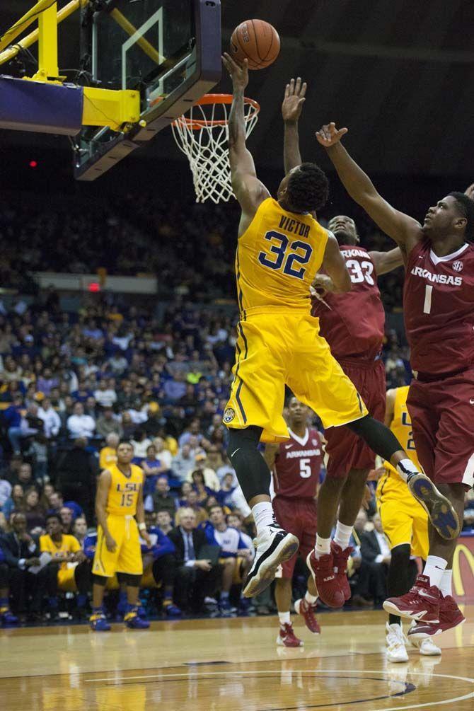 LSU sophomore forward Craig Victor II (32) goes up for a dunk during LSU's mens basketball 76-74 win against the Arkansas Razorbacks on Saturday Jan. 16, 2016, in the PMAC on LSU's campus.