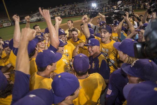 LSU baseball head coach Paul Mainieri celebrates with his players during the Tiger's 6-3 final victory in the NCAA Super Regional against ULL on Sunday, June 7, 2015 in the Alex Box Stadium.