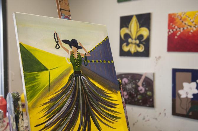 Painting and Pinot hosts Mardi Gras lady painting class