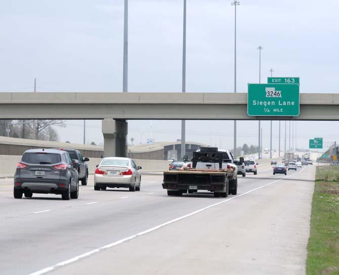 Three lanes of traffic pass on Feb. 18, 2013, on Interstate 10 near the Siegen Lane exit.