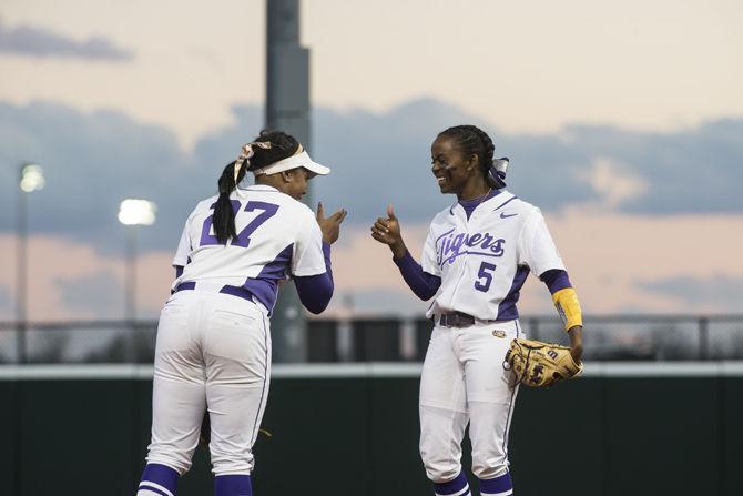 LSU senior infielder Bianka Bell (27) and junior infielder Constance Quinn (5) celebrate Wednesday, Feb. 24, 2016, during the Tigers' 5-0 victory against South Alabama in Tiger Park.