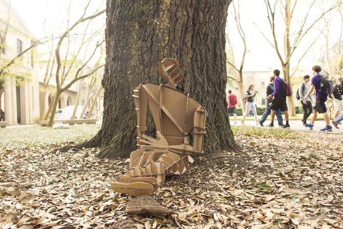 Architecture students create life-size, gameday-themed figures using recycled cardboard