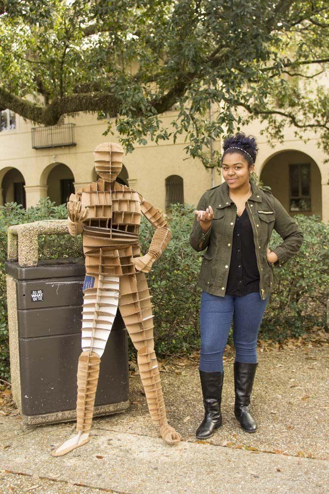 Architecture students create life-size, gameday-themed figures using recycled cardboard