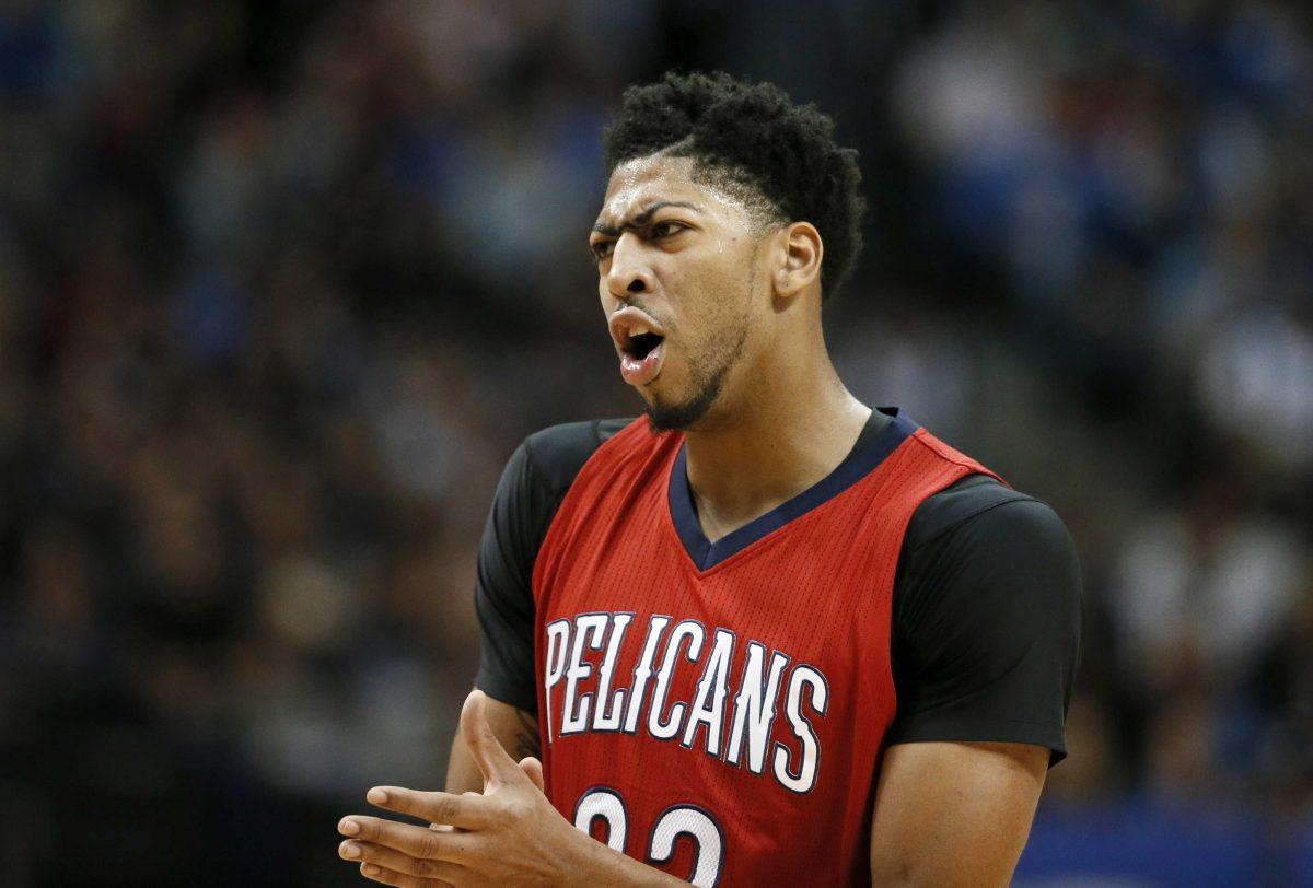 New Orleans Pelicans forward Anthony Davis (23) motivates his team during a time out in the second half of an NBA basketball game against the Dallas Mavericks on Saturday, Nov. 7, 2015, in Dallas. The Mavericks won 107-98. (AP Photo/Tony Gutierrez)