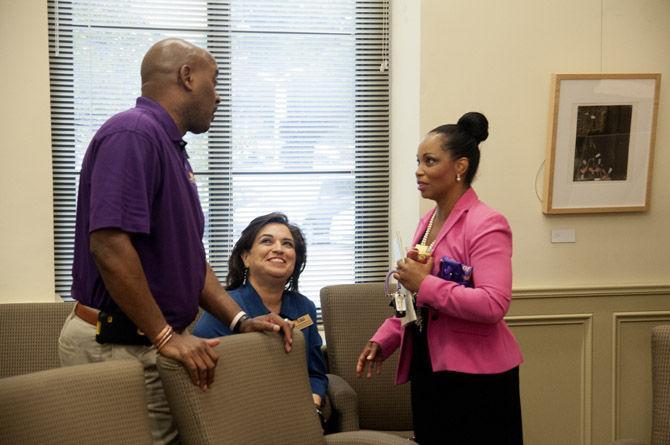 Chief diversity officer Dereck Rovaris, dean of students Mari Fuentes-Martin and associate professor Sonja Wiley have a friendly conversation Thursday, Sept. 10, 2015, during the Open House event at the Office of Diversity.