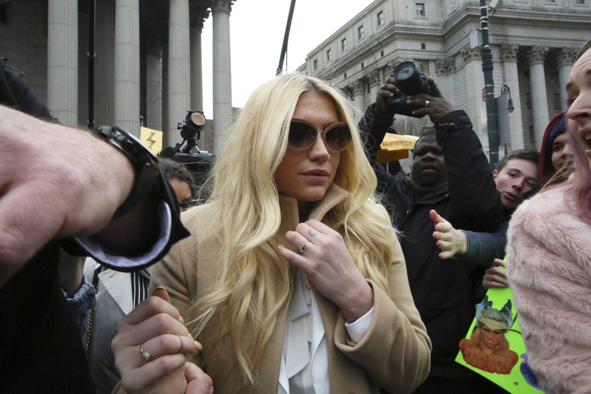 Pop star Kesha leaves Supreme court in New York, Friday, Feb. 19, 2016. Kesha is fighting to wrest her career away from a hitmaker she says drugged, sexually abused and psychologically tormented her _ and still has exclusive rights to make records with her. Producer Dr. Luke says the singer is slinging falsehoods and ruining his reputation to try to weasel out of her recording contract and strike a new deal. (AP Photo/Mary Altaffer)