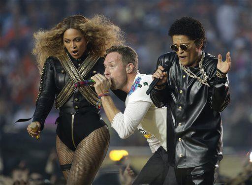 Beyonc&#233;, Coldplay singer Chris Martin and Bruno Mars perform during halftime of the NFL Super Bowl 50 football game Sunday, Feb. 7, 2016, in Santa Clara, Calif. (AP Photo/Julio Cortez)