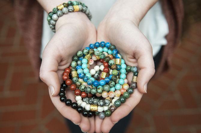 LSU psychology senior Diana Rose displays her NeedBeads bracelets Tuesday, Feb. 23, 2016. Each bracelet represents a different value or quality that wearers want to be reminded of or think that they need.