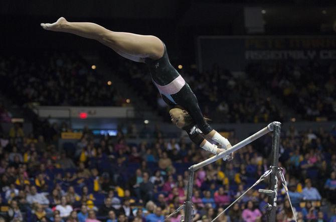 LSU all-around junior Ashleigh Gnat flips on the bars during the Tigers' 196.575-195.100 victory against Kentucky for the Pink &amp; Blue Meet on Friday, Jan. 22, 2016 in the PMAC.