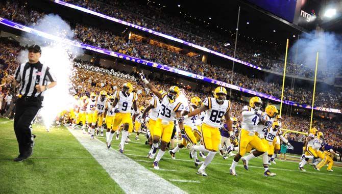 The LSU football team emerges from the locker room Saturday, August 30, 2014 before the Tigers' 28-24 victory against Wisconsin in the 2014 Advocare Texas Kickoff, held in the NRG Stadium in Houston, Texas.