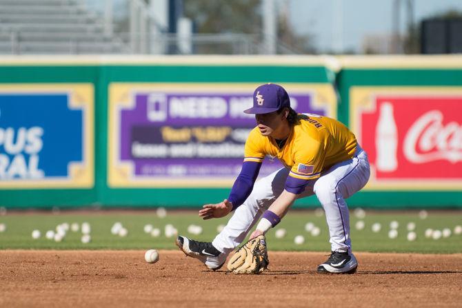 LSU junior second baseman Kramer Robertson fields ground balls at the Tigers' first preseason practice on Jan. 29 at Alex Box Stadium.