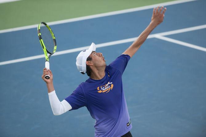 LSU junior Justin Butsch serving during LSU's victory against Drake on Friday, Feb. 19 2016 at the LSU Tennis Facility