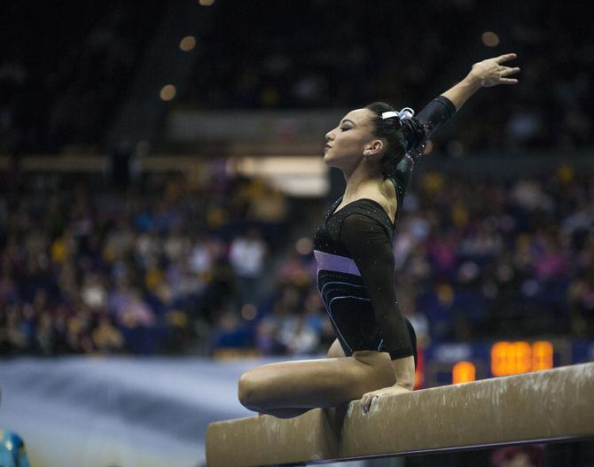 LSU all-around sophomore Myia Hambrick poses on the beam during the Tigers' 196.575-195.100 victory against Kentucky for the Pink &amp; Blue Meet on Friday, Jan. 22, 2016 in the PMAC.