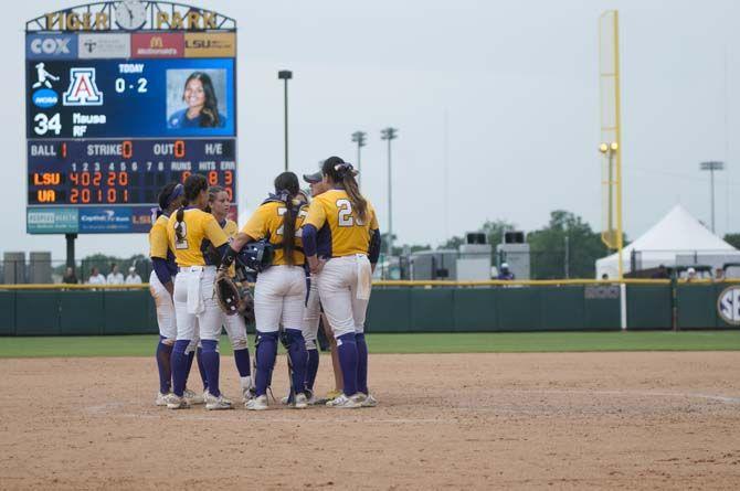 The LSU Lady Tigers&#8217; infield discuss strategy before a pitch during the Tigers&#8217; 10-5 final victory against Arizona on Sunday, May 24, 2015 in Tiger Park.