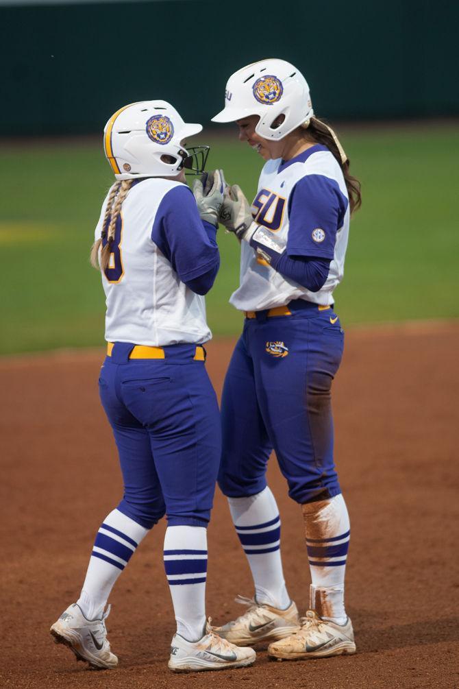 LSU sophmore otfielder Emily Griggs chatting with junior infilder Sahvanna Jaquish during their 2-1 defeat against University of the Pacific on Saturday, Feb. 13, 2016 at Tiger Park