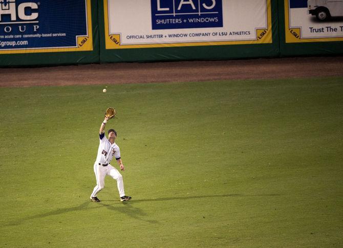 LSU sophomore outfielder Jake Fraley (23) catches a fly ball during the Tiger's 4-3 first victory in the NCAA Super Regional against ULL on Satruday, June 6, 2015 in the Alex Box Stadium.