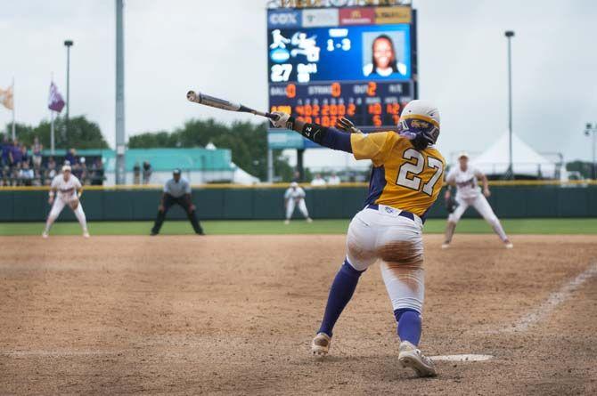 LSU junior infield Bianka Bell (27) hits the ball during the Tigers&#8217; 10-5 final victory against Arizona on May 24, 2015, in Tiger Park.