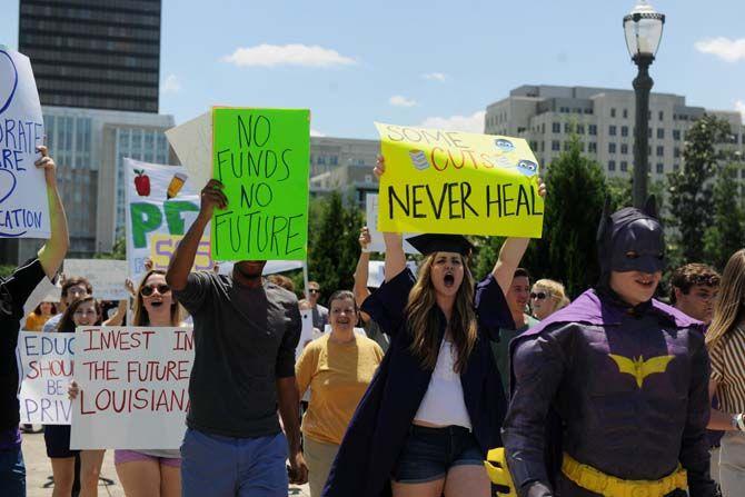 Protestors march towards the Louisiana State Capitol building Thursday, Apr. 30, 2015 in protest of higher education budget cuts.