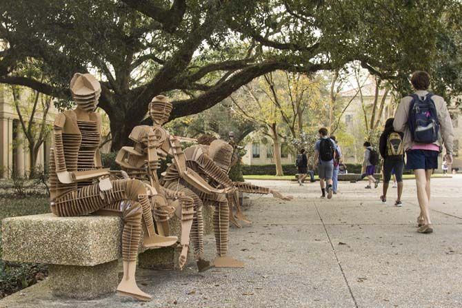 Architecture students create life-size, gameday-themed figures using recycled cardboard