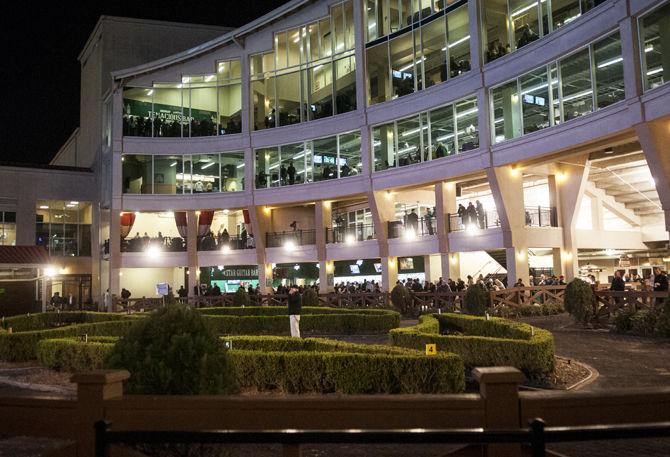 Spectators gather to view horses prior to the race Friday, Feb. 26, 2016, at Starlight Racing at the Fair Grounds Race Course &amp; Slots in New Orleans. The nighttime event featured nine races and a variety of entertainment.