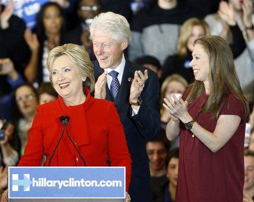 Democratic presidential candidate Hillary Clinton speaks in front of former President Bill Clinton and daughter Chelsea during a caucus night rally at Drake University in Des Moines, Iowa, Monday, Feb. 1, 2016. (AP Photo/Patrick Semansky)