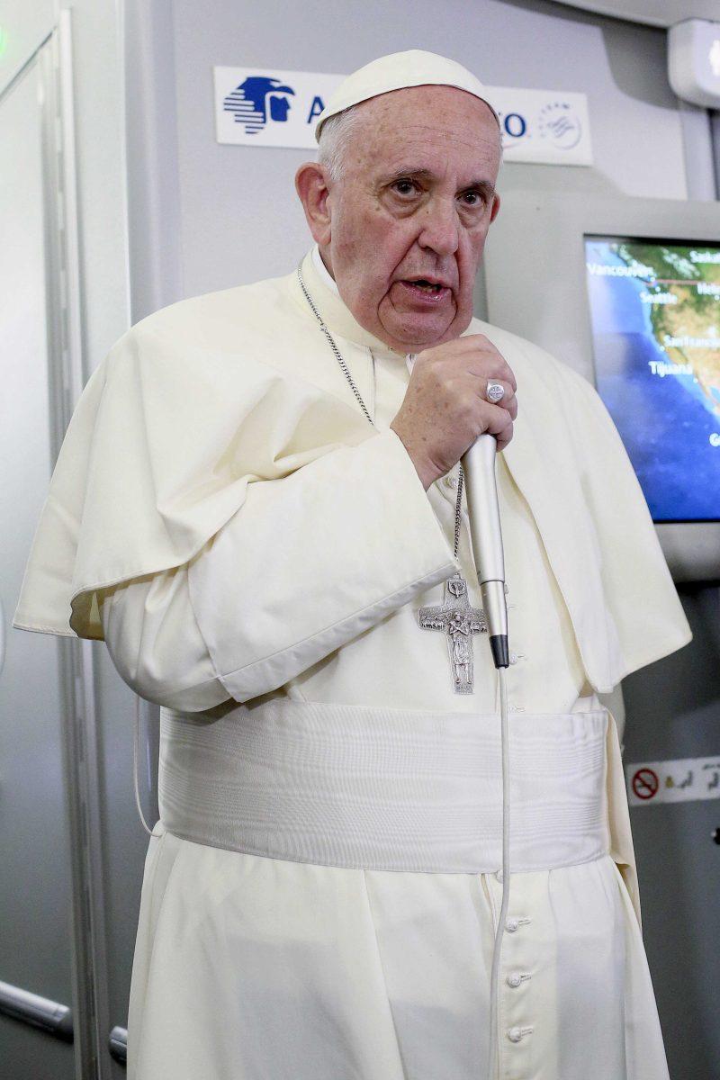 In this photo taken Wednesday, Feb. 17, 2016 Pope Francis meets journalists aboard the plane during the flight from Ciudad Juarez, Mexico, to Rome, Italy. The pope has suggested that women threatened with the Zika virus could use artificial contraception but not abort their fetus, saying there's a clear moral difference between aborting a fetus and preventing a pregnancy. (Alessandro Di Meo/Pool Photo via AP)