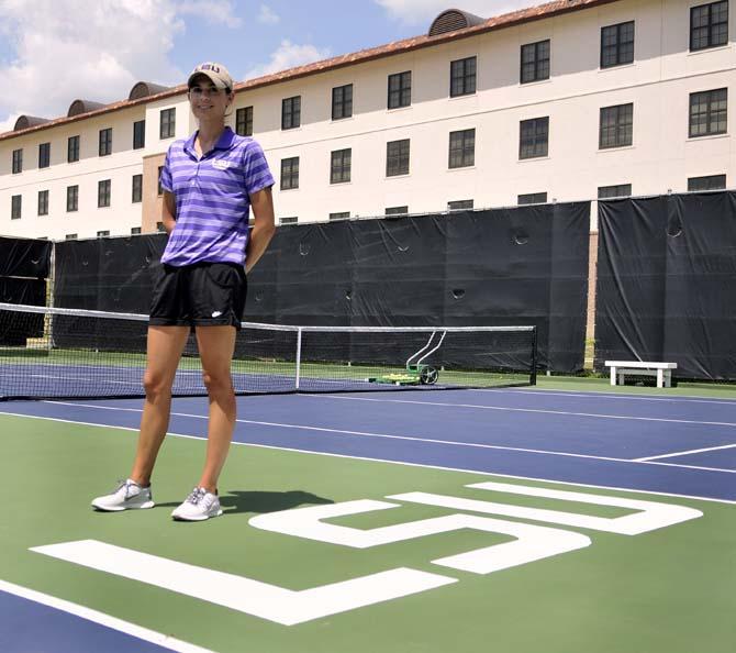 Julia Sell, LSU Woman's Tennis Head Coach, stands on the courts at W.T. 'Dub' Robinson Stadium on June 12, 2013.