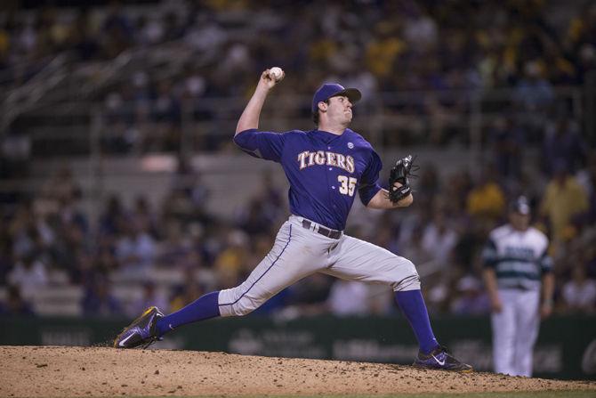 <p>LSU freshman Alex Lange (35) pitches during the Tiger's 2-0 victory against UNC Wilmington on Saturday, May 30, 2015 in Alex Box Stadium.</p>