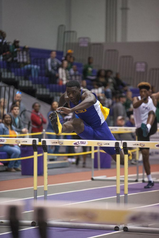 LSU junior Jordan Moore leaps over hurdles during the Tigers' Track and Field Meet on Saturday, Jan. 16, 2015 in the B. Moore Track &amp; C. Maddox Field House.