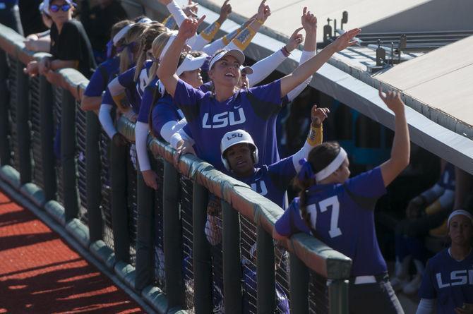 LSU sophomore pitcher Carley Hoover (21) cheers with her teammates for fans during the Tigers' 9-1 victory against Illinois State on Saturday, Feb. 27, 2016 in Tiger Park.