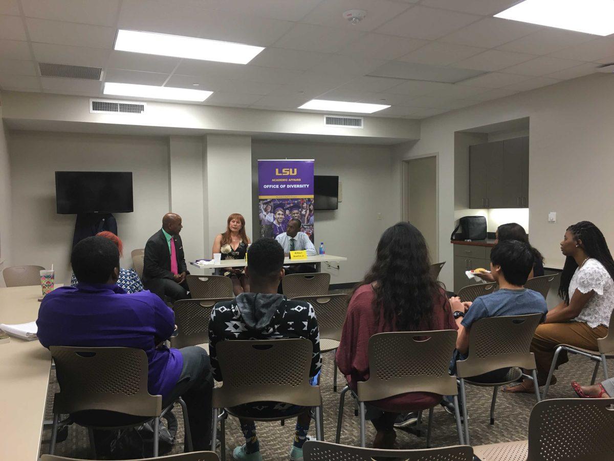 Joann Guidos and Wilbert J. Rawlins, Jr., subjects of the book "Nine Lives: Death and Life in New Orleans," participate in a panel discussion in the Women's Center on Monday.