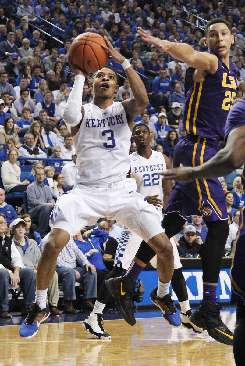 Kentucky's Tyler Ulis (3) shoots while defended by LSU's Ben Simmons during the second half of an NCAA college basketball game Saturday, March 5, 2016, in Lexington, Ky. Kentucky won 94-77. (AP Photo/James Crisp)