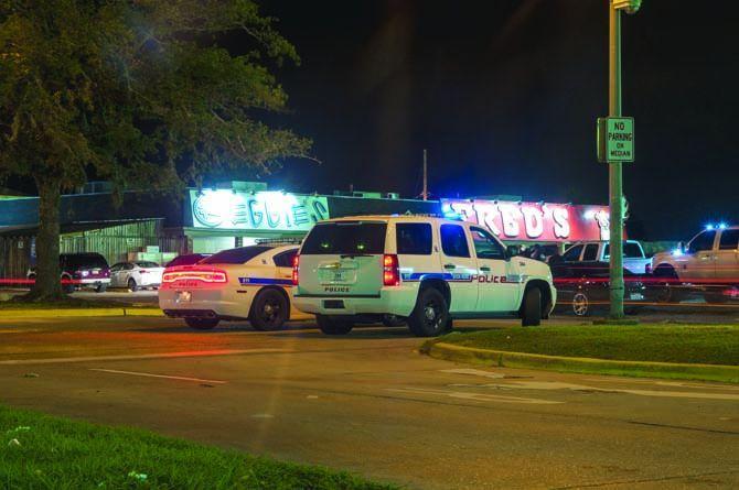 Baton Rouge police position themselves in the median outside of the bars on Monday Nov. 16, 2015, at Reggie&#8217;s and Fred&#8217;s in Tigerland.