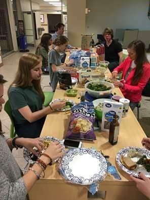 The Animal Advocates attend a vegan potluck with the Plant-based Society.