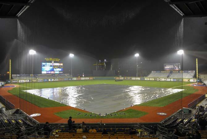 Rain soaks Alex Box Stadium on Tuesday, Feb. 25, 2014. The game between LSU and ULL was called after more than an hour delay, with the Ragin' Cajuns declared the winner by a score of 4-1.