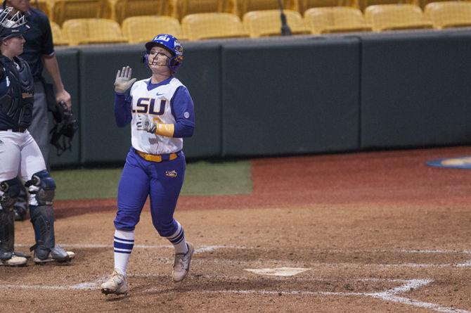 LSU sophomore outfielder Emily Griggs (8) celebrates after scoring a run during game one of the Tigers' 4-0 victory against Longwood University on Tuesday, Mar. 8, 2016 in Tiger Park.