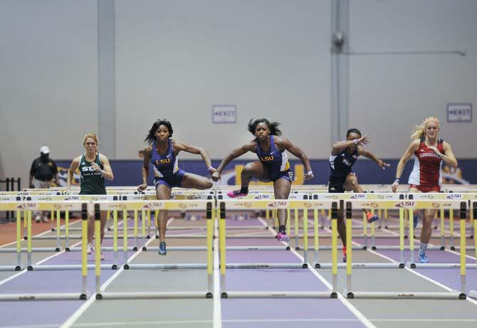 LSU hurdles junior Chanice Chase, left, and hurdles senior Mariah Georgetown, right, run Friday, Jan. 9, 2015 during the Tigers track and field meet inside the Carl Maddox Field House.