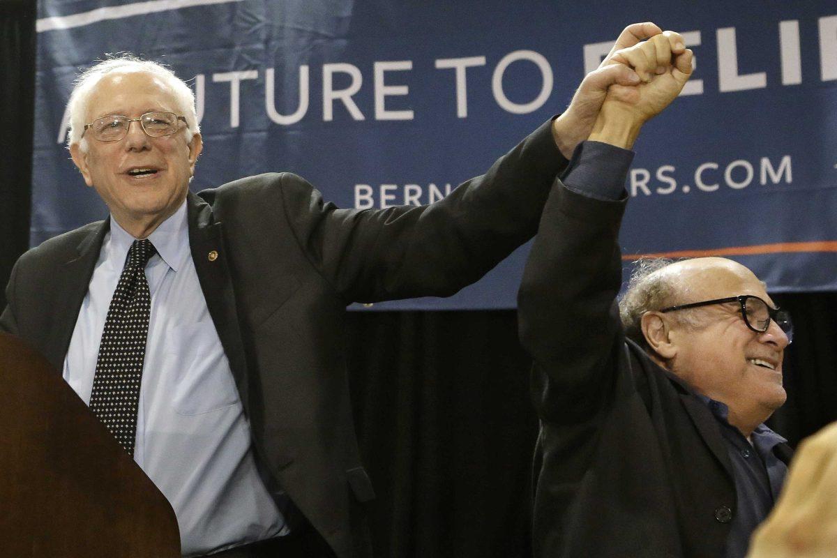 Actor Danny DeVito, right, shows support for Democratic presidential candidate Sen. Bernie Sanders, I-Vt., left, before speaking during a campaign rally at Affton High School Sunday, March 13, 2016, in St. Louis. (AP Photo/Seth Perlman)