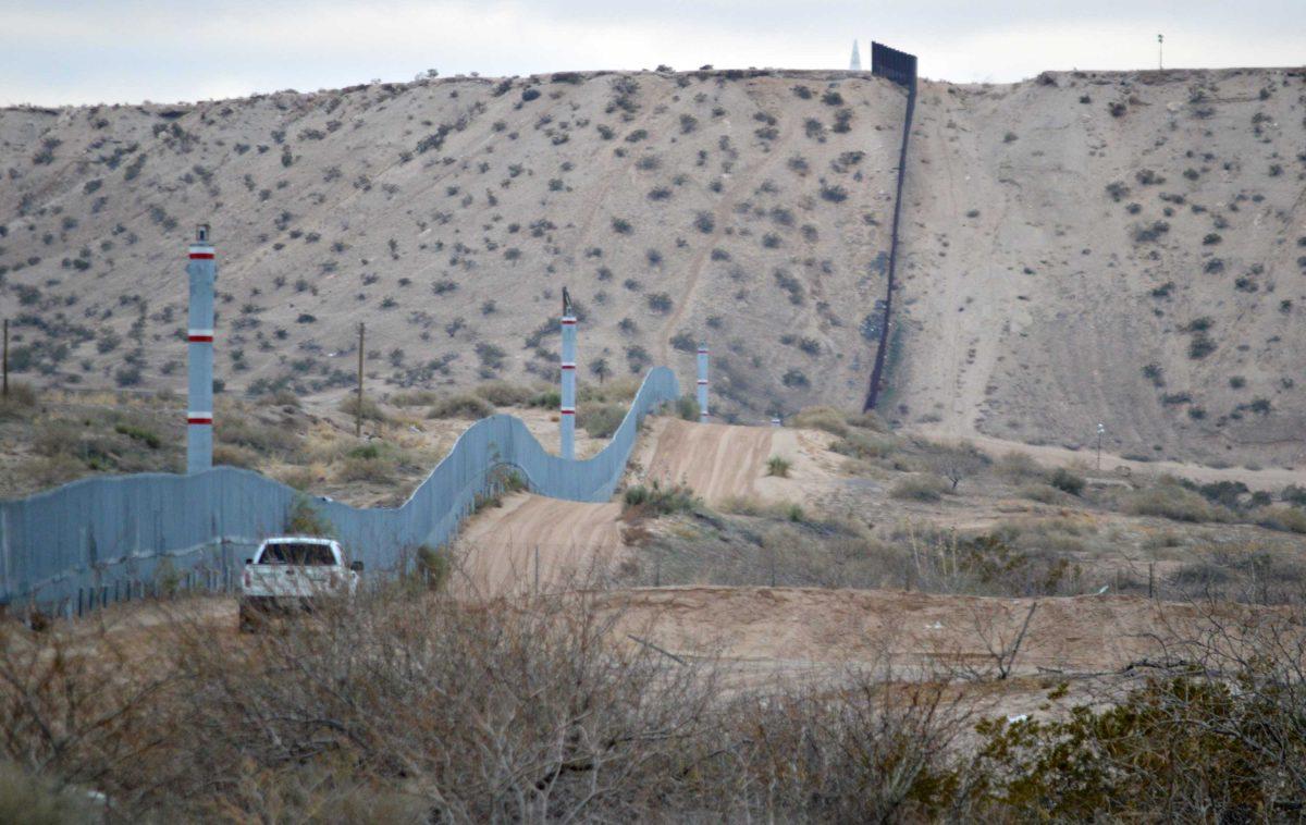 FILE - In this Jan. 4, 2016 photo, a U.S. Border Patrol agent drives near the U.S.-Mexico border fence in Sunland Park, N.M. Can Donald Trump really make good on his promise to build a wall along the 2,000-mile U.S.-Mexican border to prevent illegal migration? What&#8217;s more, can he make Mexico pay for it? Sure, he can build it, but it&#8217;s not nearly as simple as he says. (AP Photo/Russell Contreras)