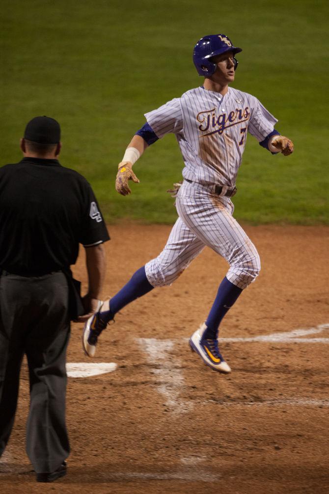 LSU sophmore Greg Deichmann (7) scores a run during LSU's 6-3 win against Louisiana Tech on Tuesday, March 8, 2016 at Alex Box Stadium