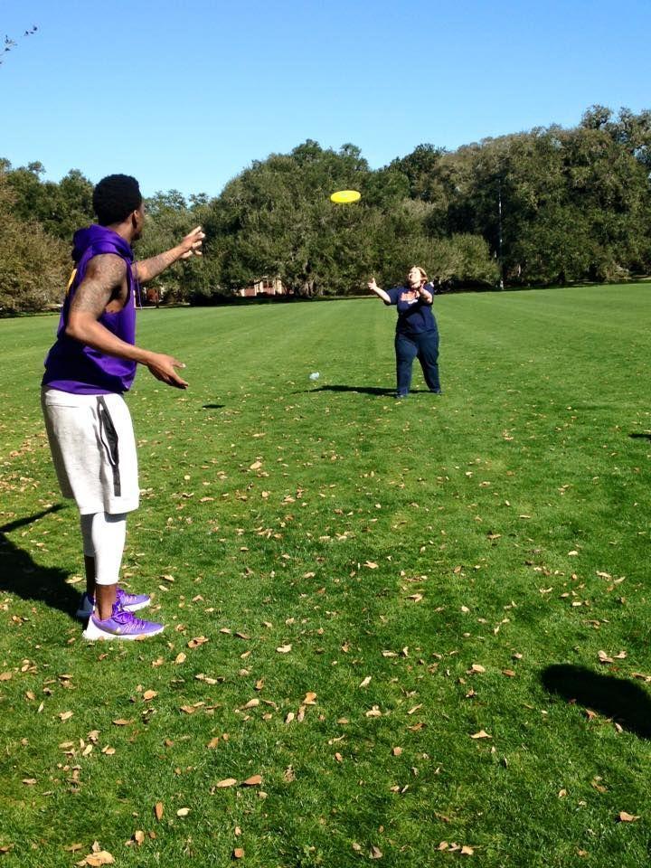 LSU football player Arden Key tosses a frisbee with a member of Best Buddies during the University organization's February meetup.