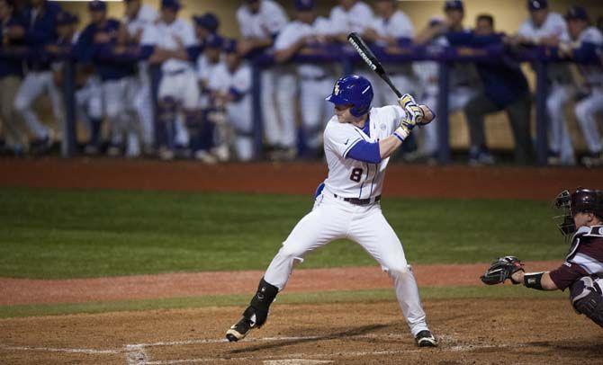 LSU junior outfielder Jake Fraley (8) takes a step before making his swing at the pitch during LSU's 12-1 win against Fordham in Alex Box Stadium on Friday March 4, 2016.