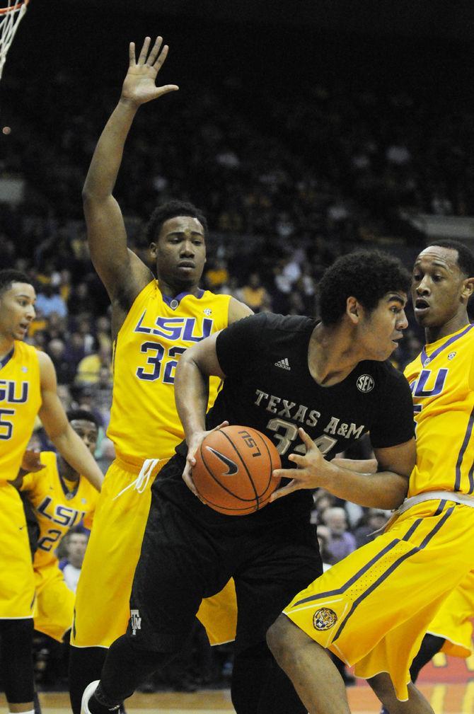 Craig Victor II, 32, and Tim Quarterman, 55, play defense against Tyler Davis, 34, Texas A&amp;M player during the 76-71 LSU victory against Texas A&amp;M on Saturday, February 13, 2016 in the PMAC.